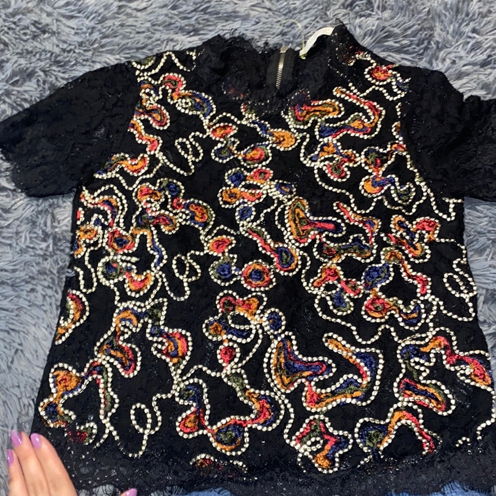 From Zara black with colored in it , good condition